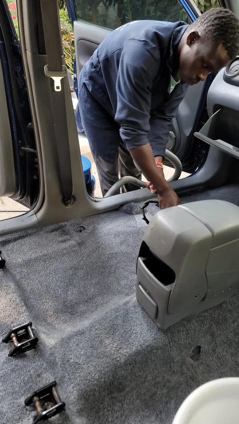 Vehicle interior opened for detailed carpet and cabin cleaning