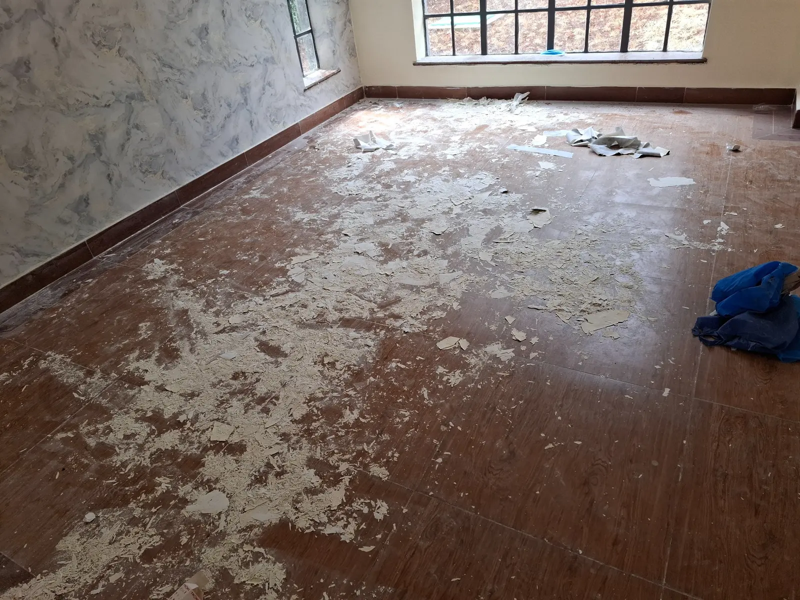 Dusty post-construction floor before cleaning